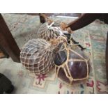 Three netted glass fishing floats