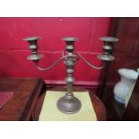 A pair of silver plated candlesticks, one missing holder