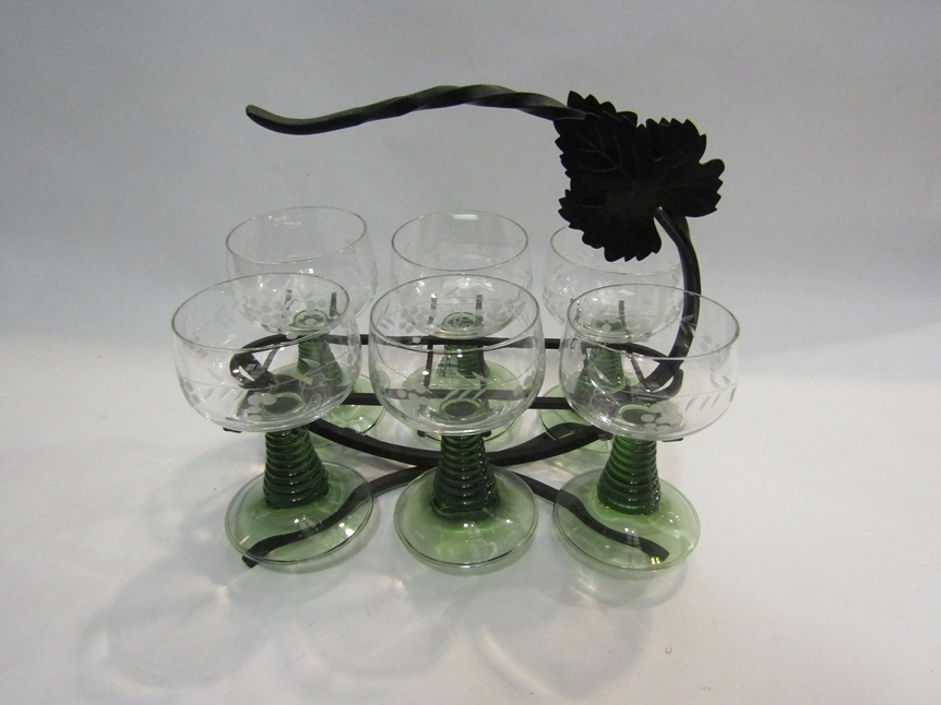 A set of six green stem wine goblets with grape and vine etched design together with a metal