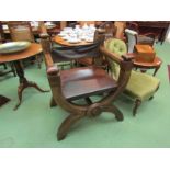 A 19th Century pine and leather 'Savaranola' armchair with studwork and roundel decoration