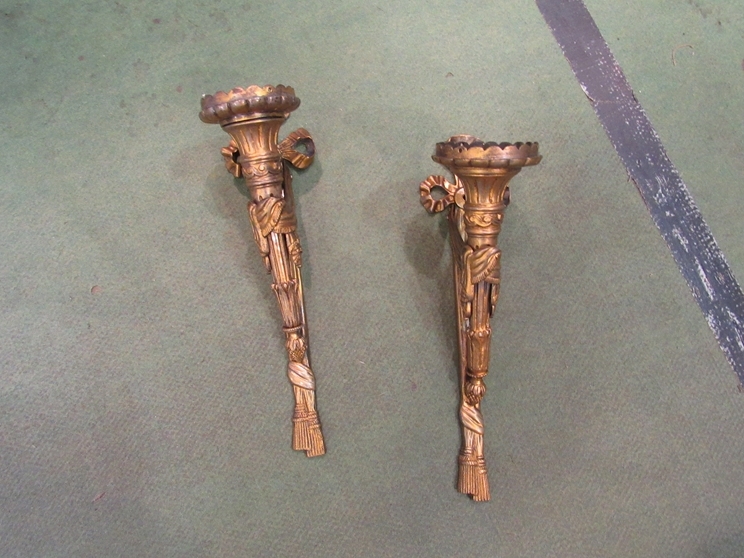 A pair of reproduction gilt wall sconces