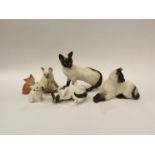 A selection of Beswick, Royal Doulton and Royal Worcester cat figures, tallest 16.5cm (6)