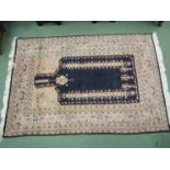 An Eastern machine woven wool rug with multiple borders and tasselled ends, 180cm x 122cm