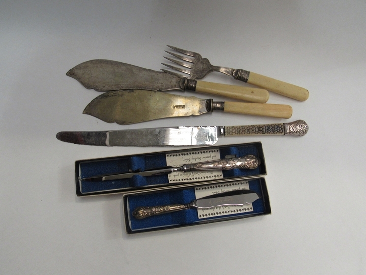 A silver handled butter knife and letter opener, cake knife, fish servers with silver ferrules (6)