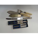 A silver handled butter knife and letter opener, cake knife, fish servers with silver ferrules (6)