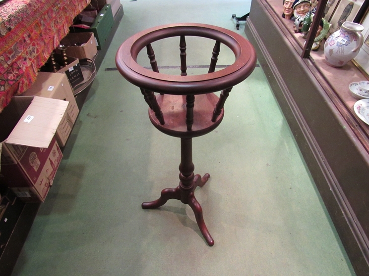 A wooden jardiniere stand on tripod legs, 82cm tall