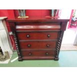 A mid-Victorian mahogany Scottish chest of four graduating long drawers flanked by turned spiral