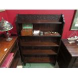 A Circa 1900 oak five tier bookshelf with blind fret carved decoration. 135cm x 90cm x 23cm