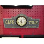 A "Cafe de la Tour" advertising wall hanging clock