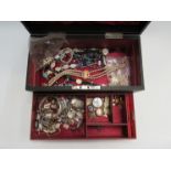 Jewellery box and mostly bijouterie contents including necklaces, bracelts, whistle, vesta case