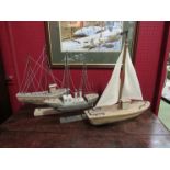 Three wooden model boats