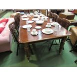 A Circa 1840 style mahogany extending dining table with two extra leaves over turned and fluted