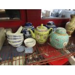 A selection of ginger jars, a teapot, blue and white bowls and dishes