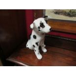 A Winstanley figure of a dalmatian puppy, crazed, 23.5cm high