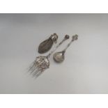 A Dutch silver plated spoon and fork depicting scene of Rotterdam and couple by boats, a silver
