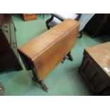 A late Victorian walnut Sutherland table on turned supports with canted corners