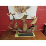 A model ship of 'The Golden Hind', 64cm high including stand