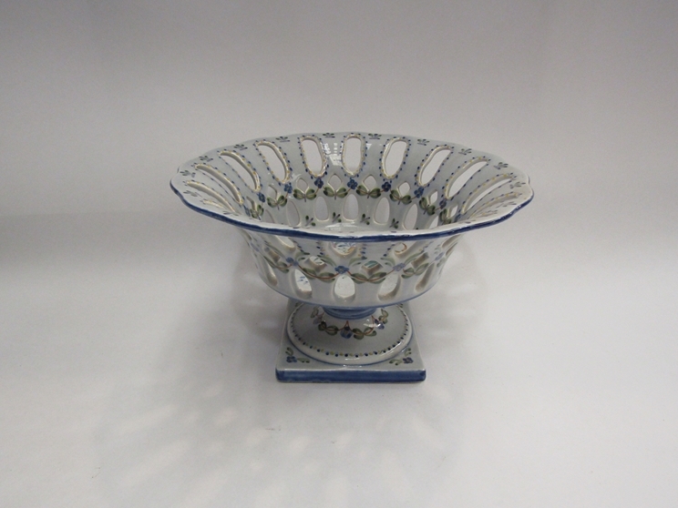 A Portuguese pierced form fruit bowl, square form base, handpainted, 15cm high, 24cm diameter