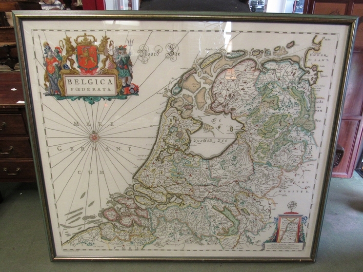A large embroidery depicting the Netherlands, framed and glazed, 120cm x 138cm