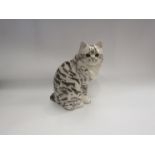 A Winstanley figure of a seated cat, 27cm high, a/f