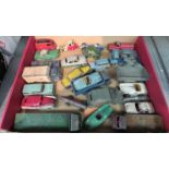 A selection of playworn die-cast vehicles, mainly Dinky including military examples