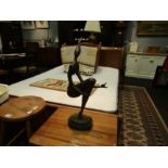 An abstract bronze figure of lady with bird in hand on marble base, 57cm tall