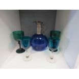 A 19th Century Bristol blue glass decanter with pewter mount and handle, 20cm high, plus two 19th