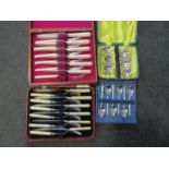 A quantity of cased cutlery