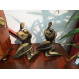 A pair of reproduction modernist bronzed sculptures of a couple