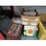 Three boxes and a case of 7" singles including Squeeze, Queen, Simon and Garfunkel, The B52's, David