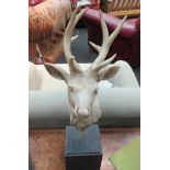 A resin stags head and antler, repairs to horns, 47cm tall