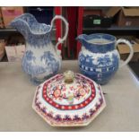 A 19th Century Staffordshire blue and white jug and a willow pattern large dairy milk jug. An