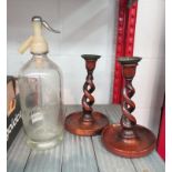 A Newhaven soda syphon and pair of oak candlesticks