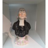 A 19th Century Staffordshire pottery bust of John Wesley, 28.5cm tall