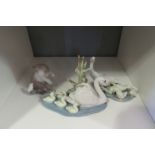 Three Lladro figures, swans and cygnets, geese and goslings and cat and mouse