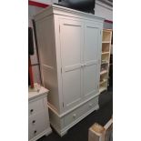 A Cotswold Company white two door wardrobe with drawer, 191cm x 111cm 58cm