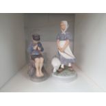 Two Royal Copenhagen figurines of girl with goose (chipped beak) and seated boy