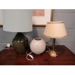A glazed stoneware lamp base, cream shade with patterned lining, a pierced cream bulbous table