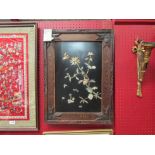 A pair of Oriental mother-of-pearl inlaid pictures of birds and branches in heavily carved frames (