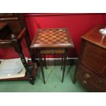 An Edwardian chess board top side table with single drawer on turned legs, piece missing, 71cm x