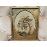 An early 19th Century embroidery on silk of a bird in a naturalistic setting, oval mount, framed and