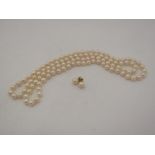 A single strand pearl necklace. 92cm long and a pair of stud earrings