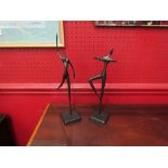 A pair of modernistic metal figures of dancers, tallest 33cm