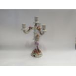 A Continental style candelabrum with encrusted flowers, restored, 38cm tall