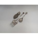 A Dutch silver plated spoon and fork depicting scenes of Rotterdam and couple by boats, a silver