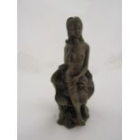 A brass bronze effect figure of a semi-clad lady seated on a lilypad, mark to back, 22cm tall