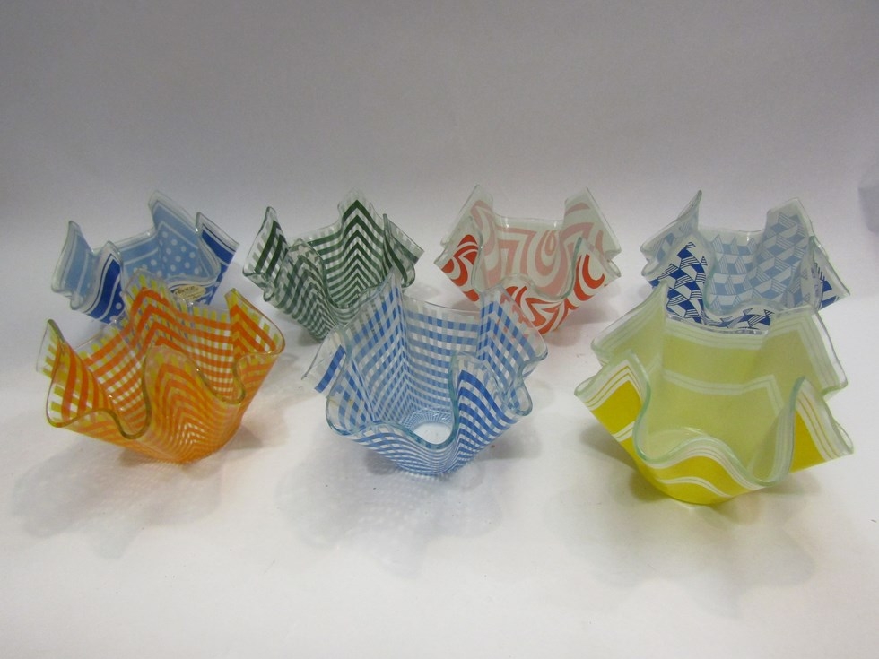 Seven glass handkerchief vases, one with Chance glass label, most 10cm tall