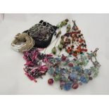 A quantity of bead necklaces including Macy's