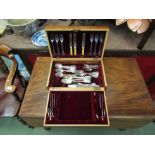 A canteen containing assorted plated cutlery and two silver teaspoons