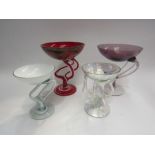 Four art glass dishes, smallest 14cm, largest 19cm tall